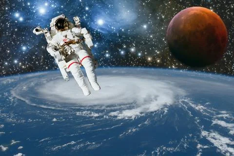 Astronaut spaceman do spacewalk while working for space station in outer space Stock Photos
