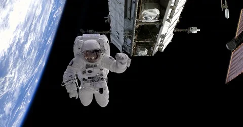 Astronaut Spacewalk Floating by Space Station and Above Earth, 4K Stock Footage 75690973
