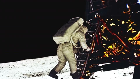 Astronaut taking large step off of lunar craft on the moon In slow motion close Video stock 154668748