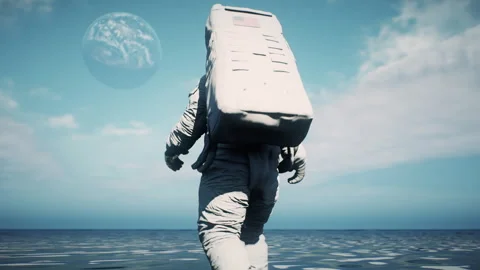 Astronaut walking carefully In The Ocean on an alien planet with Earth in t.. Stock-Footage 240411519