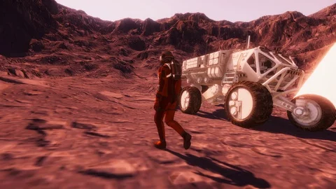 Astronaut Walking On Mars Like Landscape In Front Of A Rover Video stock 91798192