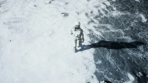 The astronaut is walking on a new unknown snow planet under alien constellations Stock Footage 132211817