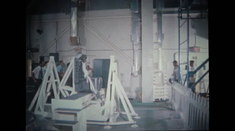 Astronaut walks towards test stand with technicians Stock Footage 37597107