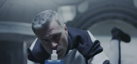 Astronaut watching liquid floating in zero gravity Video stock 120264821