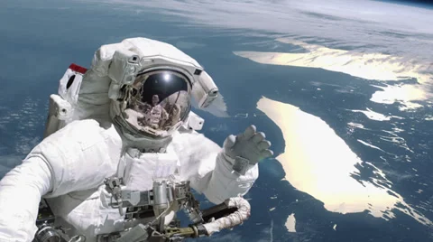 Astronaut waves in deep space - 4K Stock Footage
