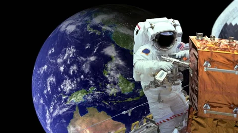 Astronaut working in space earth in background Stock Footage 50025037