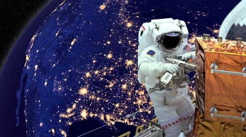 Astronaut working in space earth in background Stock Footage 50028173