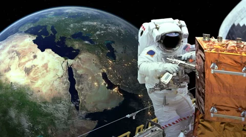 Astronaut working in space earth in background Stock Footage 50031649