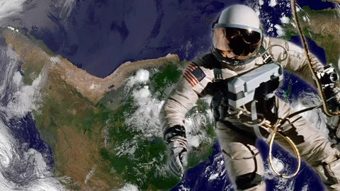 Astronaut works in orbit on a spaceship. Elements of image furnished by NASA. Stock Footage 112755042