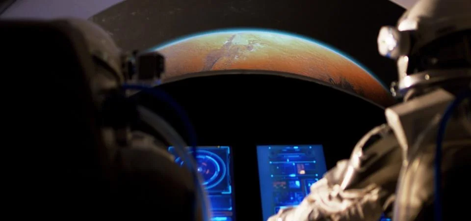 Astronauts approaching Mars with spaceship Stock Photos