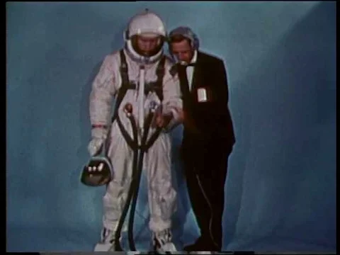 Astronauts arrive, get in elevator, ascend and board the Gemini 4 spacecraft; Stock Footage 75287525