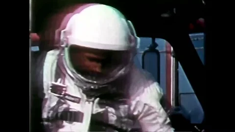 Astronauts arrive, get in elevator, ascend and board the Gemini 4 spacecraft; Stock Footage 85203388