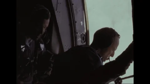 Astronauts Cooper and Conrad take pictures from open hatch of
airplane - 1965 Stock Footage 101919720