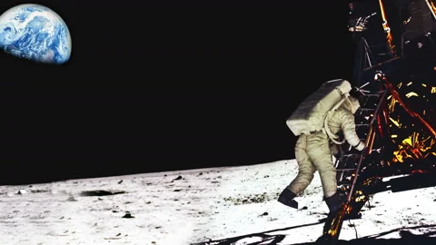 Astronauts first steps off the lunar craft onto the moon Stock Footage 154669209