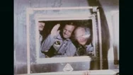 Astronauts Greeting From Window Of Mobile Quarantine Facility Stock Footage