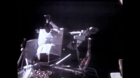 Astronauts John Watts Young and Charles Moss Duke drive a Lunar Roving Vehicle Video stock 86138232