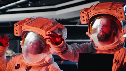 Astronauts operating starship control interface react to alien presence Stock Footage 311134985