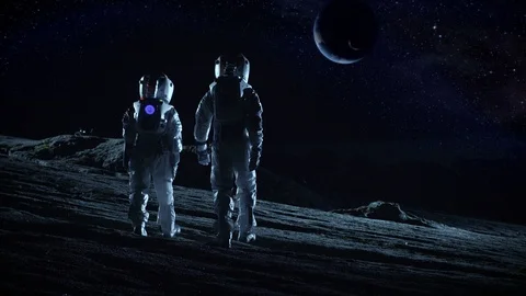 Astronauts in Space Suits Standing on Alien Planet and Looking at Planet. Stock Footage 86080596
