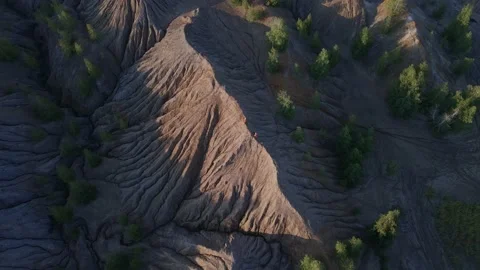 Astronauts walking through a deserted mountain landscape Stock Footage 236452680