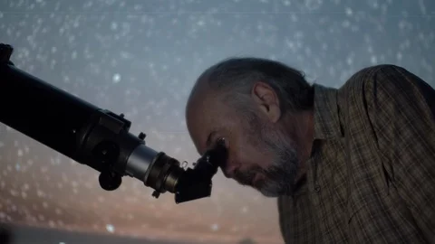 Astronomer scientist using optical instrument telescope at night sky to obser Stock Footage 107360636