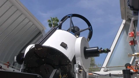 Astronomical telescope rotating in observatory Stock Footage 99084931