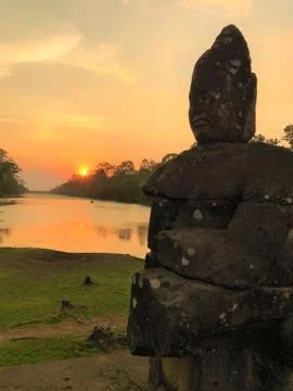 Asuras or deva statue at suns set at angkor wat, siem reap, cambodia temple o Stock Photos