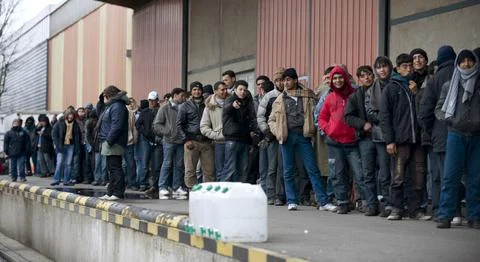 Asylum Seekers In Calais France Queue For Food Handouts Distributed By Local Cha Stock Photos