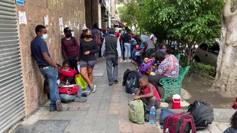 Asylum-seekers from Haiti wait to request refuge in Mexico City, Mexico 4K Stock Footage 161444361