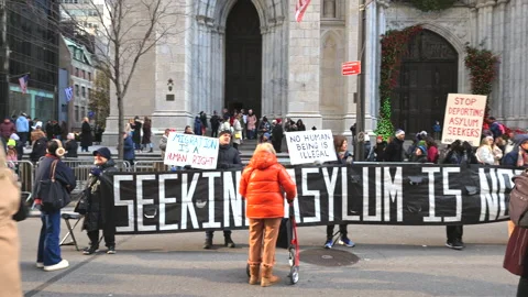 Asylum seekers supporters demonstrate on the Fifth Avenue in New York City Stock Footage 231436724
