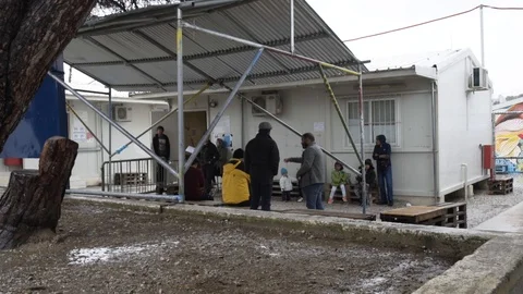 Asylum-seekers waiting for their interview in Moria refugee camp in 2019 Stock Footage 116349696