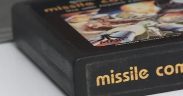 Atari 2600 Game Cartridges In Front Of Game Console - Pan Stock Footage 85966888