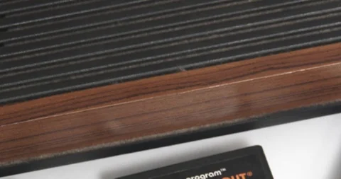 Atari 2600 Video Game System - Zoom  - With Games and Owner's Manual Stock Footage 85965933