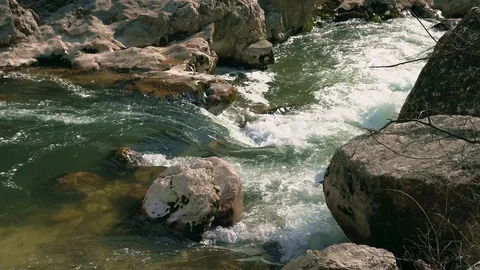The Aterno river flows among the rocks Stock Footage 126001010