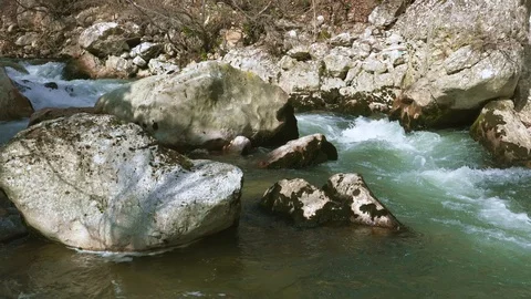 The Aterno river flows among the rocks Stock Footage 126003102