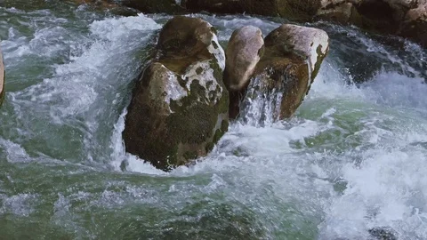 The Aterno river flows among the rocks Stock Footage 126035698
