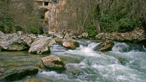 The Aterno river flows among the rocks of the gorge of the hermitage of San Vena Stock Footage 126094539