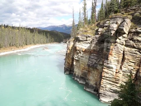 Athabasca River and cliffs in Jasper National Park, Canada.u Stock Footage 100220165
