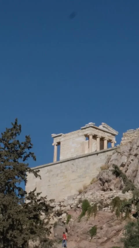 Athens with Acropolis hill on a hot summer day in Greece. Travel image of a Stock Footage 302073689