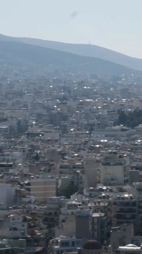 Athens with Acropolis hill on a hot summer day in Greece. Travel image of a Stock Footage 306943232
