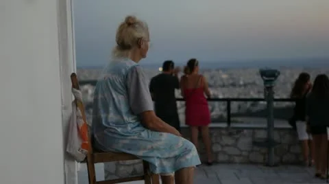 Athens city views - old woman on Likavitos hill Stock Footage