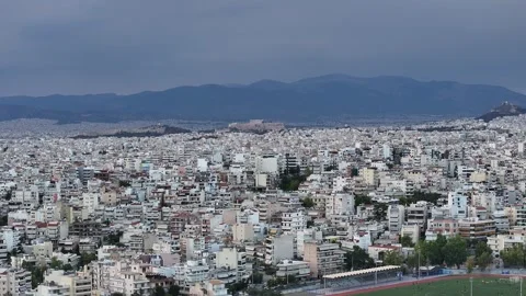 Athens cityscape with Acropolis landmark and local athletic field under Stock Footage 345372184