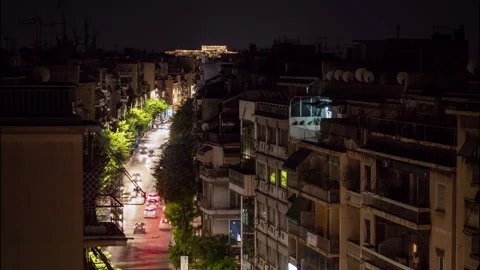Athens traffic night time lapse with Acropolis in the background Video stock 246079559