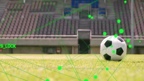 Athlete approaching rolling ball doing feint pass while GPS_LOCK overlay 動画素材 332956239