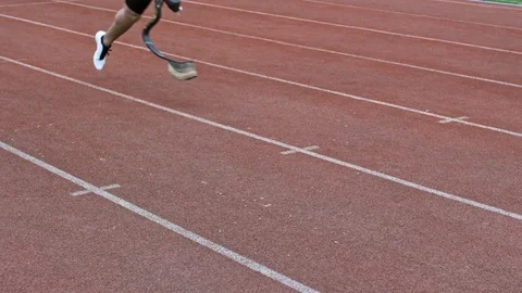 Athlete with Artificial Foot Running on Stadium Stock Footage 99767870