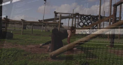 Athlete bending to crawl under beam in fitness course leaning at ramp with Video stock 327902337