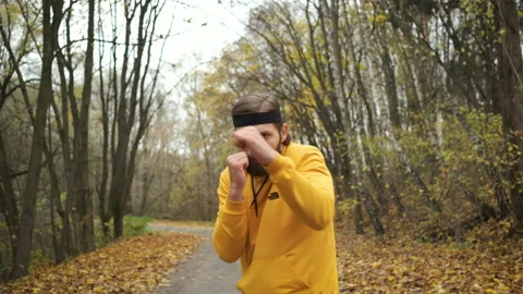 Athlete boxing in the park in front of the camera. Warm-up and motivation, goal Stock Footage 143201888