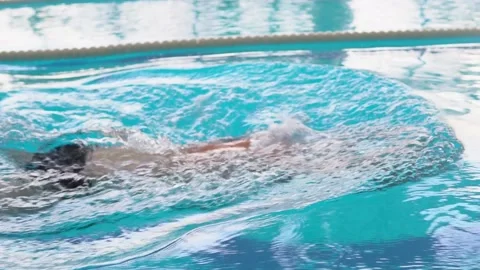 Athlete in a cap and glasses swims breaststroke in the pool Stock Footage 145757331