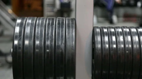 The athlete changes the weight of the load on the rod Stock Footage 55387099