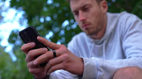 Athlete Checking Longevity Ring Data in Mobile App Stock Footage 347813271