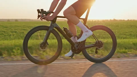Athlete checking navigation on cycle computer during ride Stock Footage 248208566